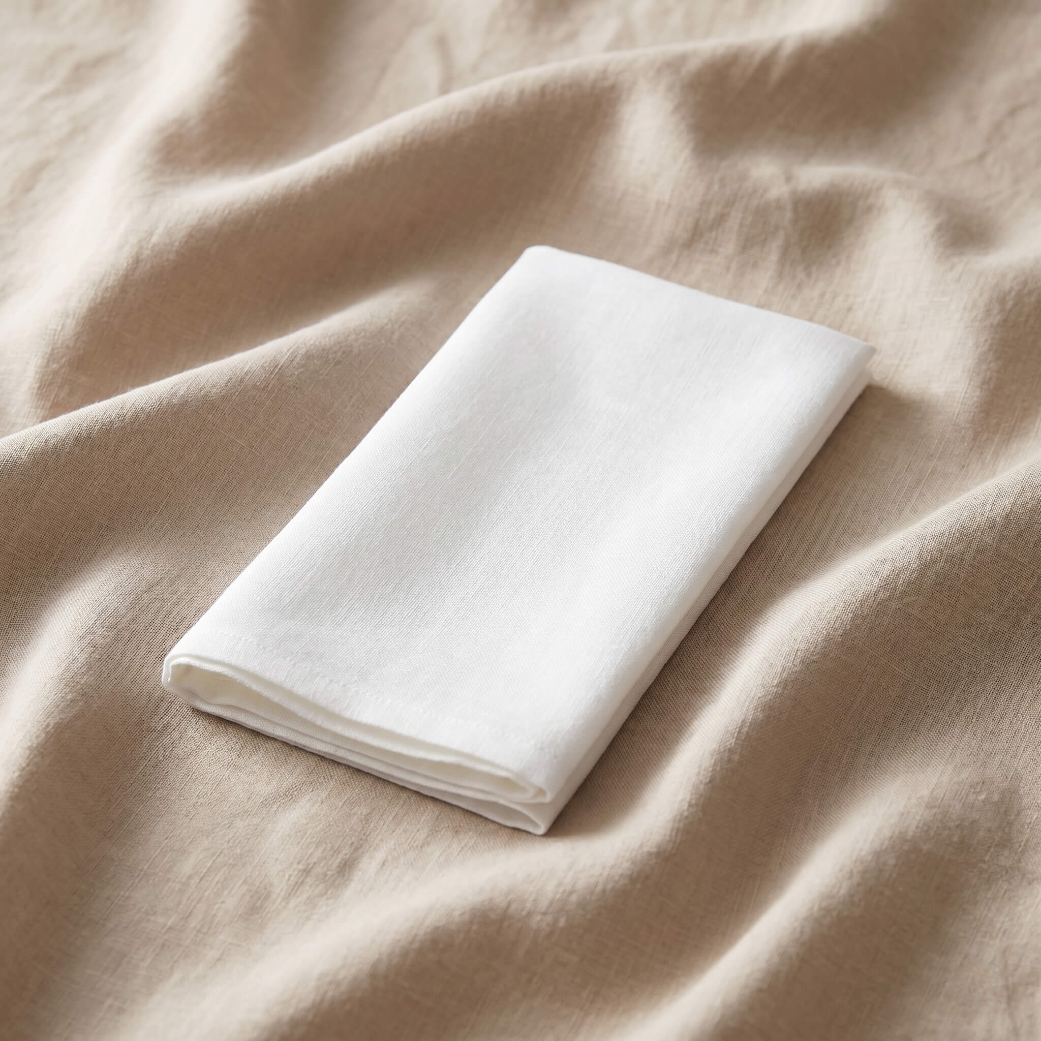 White linen napkin hire London — professionally laundered napkins for weddings and events
